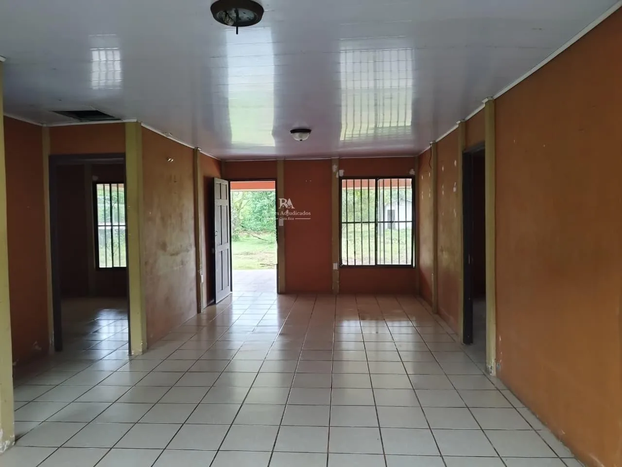 Lote con construcción en Sarapiquí
